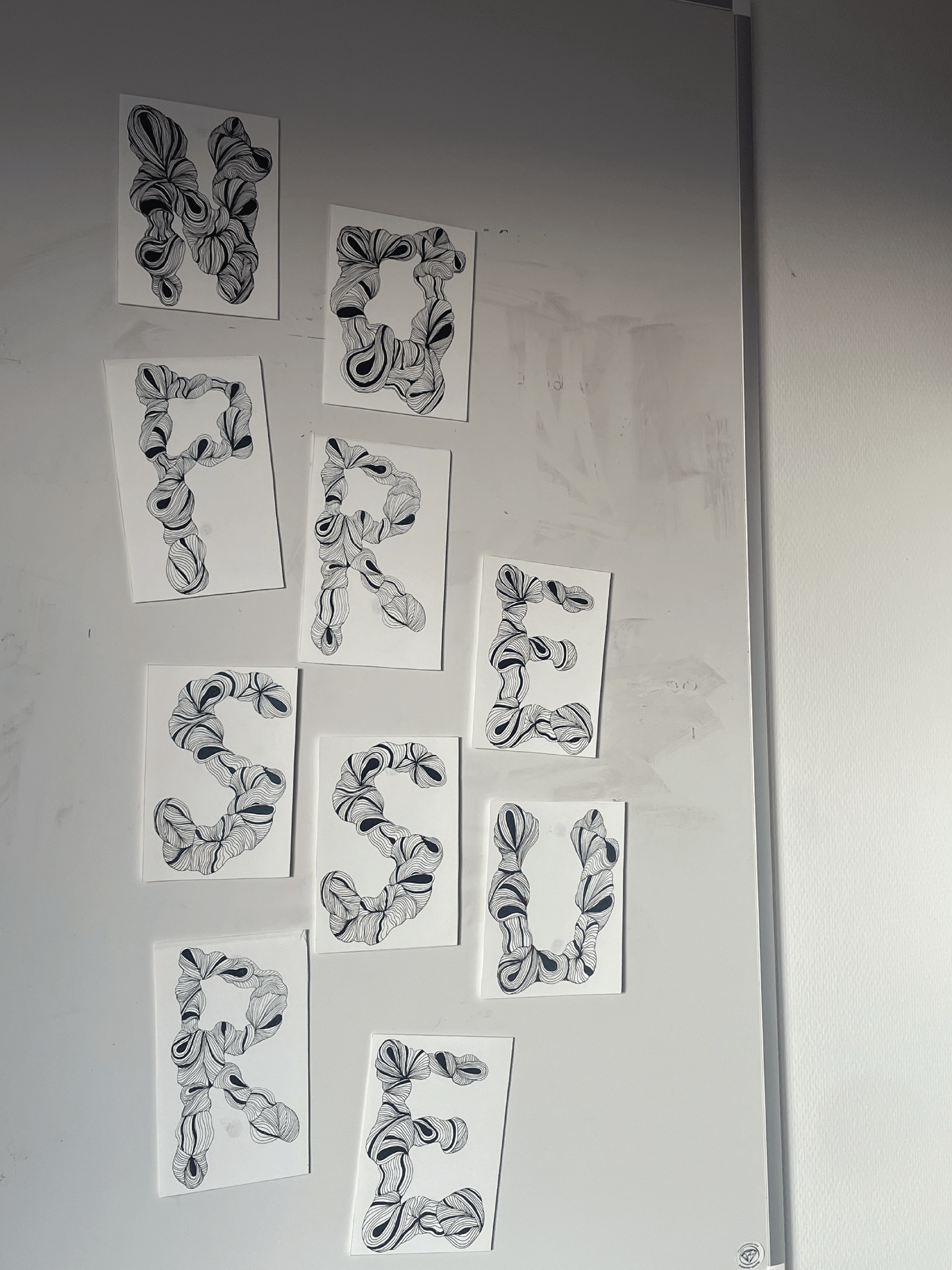 Letters arranged on wall